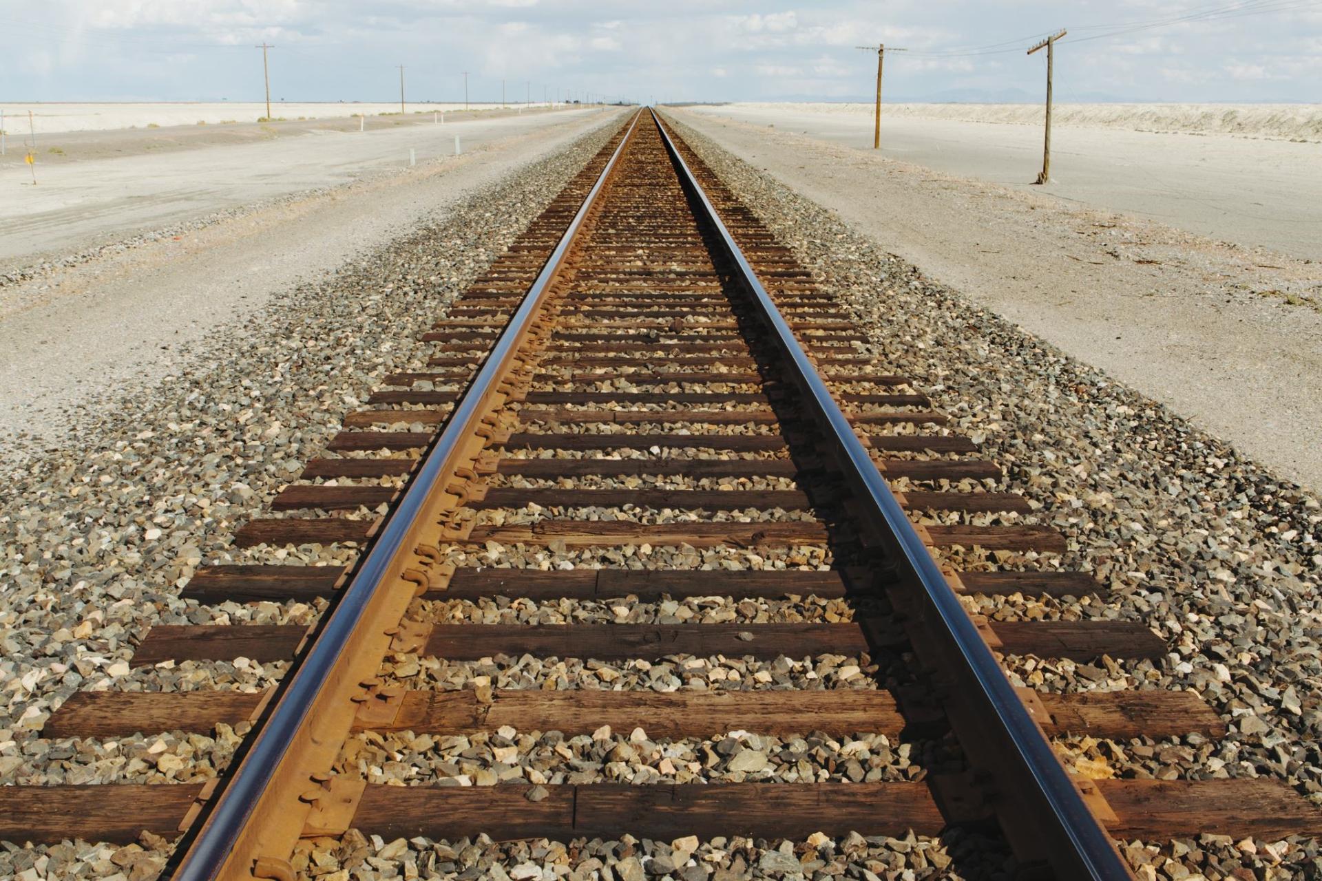 railroad tracks in the middle of the desert