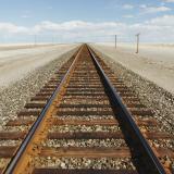 railroad tracks in the middle of the desert